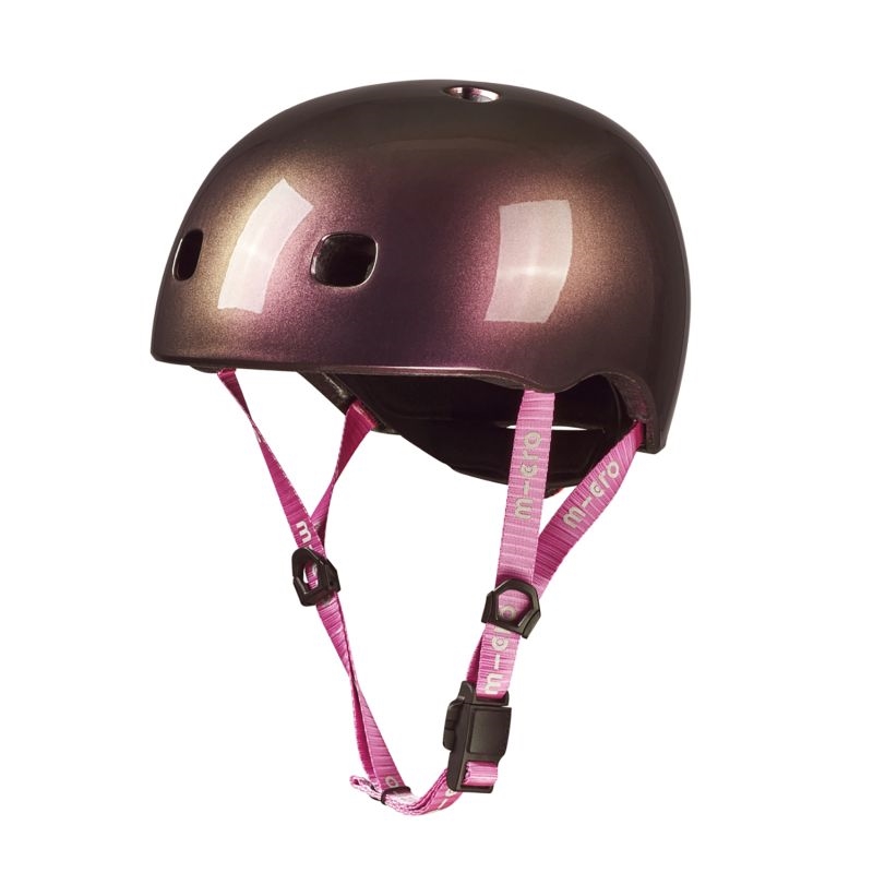 Micro-hjelm i neochrome pink med ventilationshuller og reflekterende overflade, pink stropper.